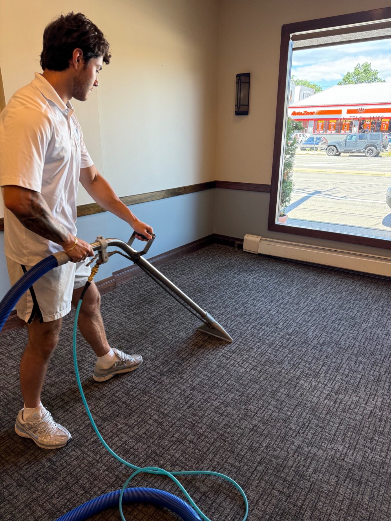Aesthetic team performing professional carpet extraction